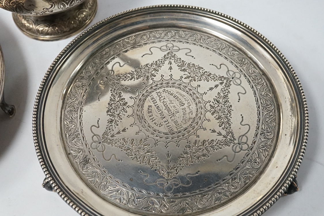 A Victorian Scottish embossed silver cream jug, Marshall & Sons, Edinburgh, 1858, 16.3cm, together with a George III silver oval teapot stand(a.f.), London, 1794 and a Victorian silver waiter, London, 1867, 19.9oz. Condi